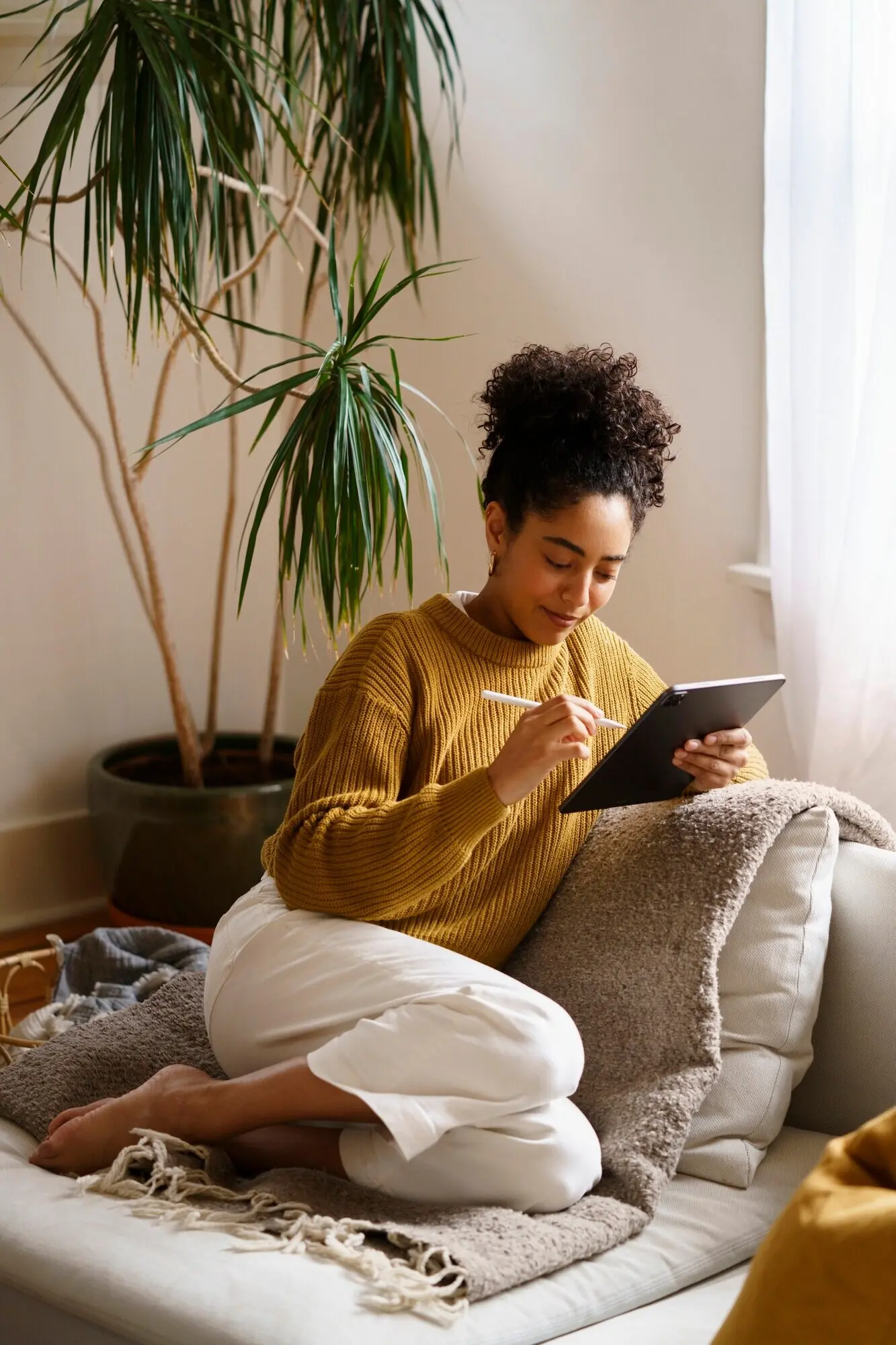 A woman utilizing digital tablet technology